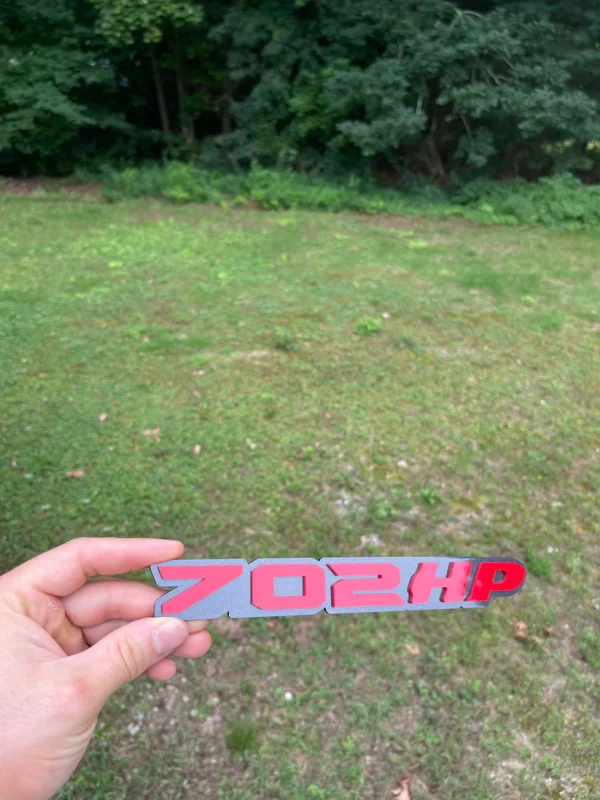 Alternative view of 702HP badge
